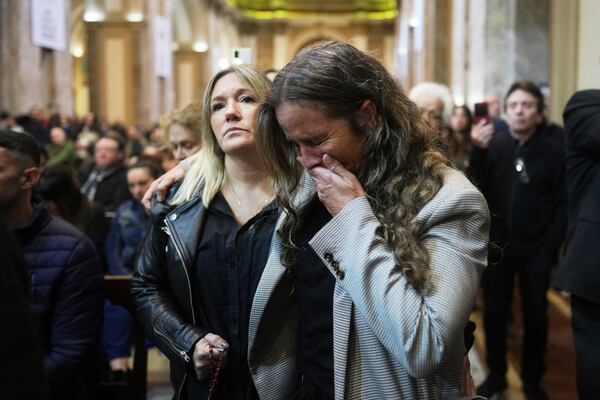 A worshipper cries during Mass at the Cathedral in Buenos Aires, Argentina, following the Vatican's announcement of Pope Francis' death, Monday, April 21, 2025. (AP Photo/Natacha Pisarenko)