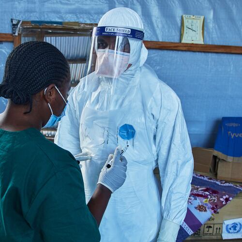 Health workers interact at the Evangelical Medical Center, in Bunia, eastern Congo, Friday, July 3, 2026, where Ebola clinical trials are scheduled to take place. (AP Photo/Dirole Lotsima Dieudonne)