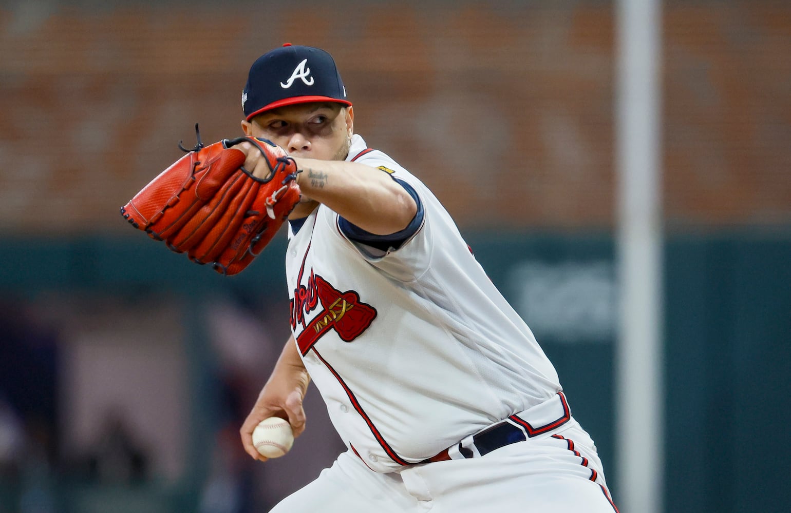 Atlanta Braves relief pitcher Joe Jimenez (77) delivers to the Philadelphia Phillies during the sixth inning of NLDS Game 2 in Atlanta on Monday, Oct. 9, 2023.   (Miguel Martinez / Miguel.Martinezjimenez@ajc.com)