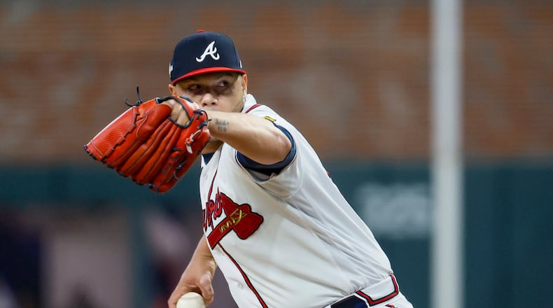 Atlanta Braves relief pitcher Joe Jimenez (77) delivers to the Philadelphia Phillies during the sixth inning of NLDS Game 2 in Atlanta on Monday, Oct. 9, 2023. (Miguel Martinez / Miguel.Martinezjimenez@ajc.com)