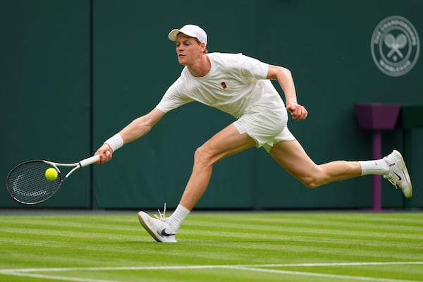 Jannik Sinner of Italy plays a return to Daniil Medvedev of Russia during a practice session on Centre Court at the All England Lawn Tennis and Croquet Club, ahead of the Wimbledon Championships in London, Thursday, June 26, 2025. (AP Photo/Kirsty Wigglesworth)