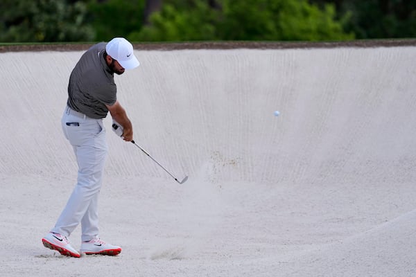 Scottie Scheffler hits from the bunker on the second hole during the third round at the Masters golf tournament, Saturday, April 12, 2025, in Augusta, Ga. (AP Photo/Ashley Landis)