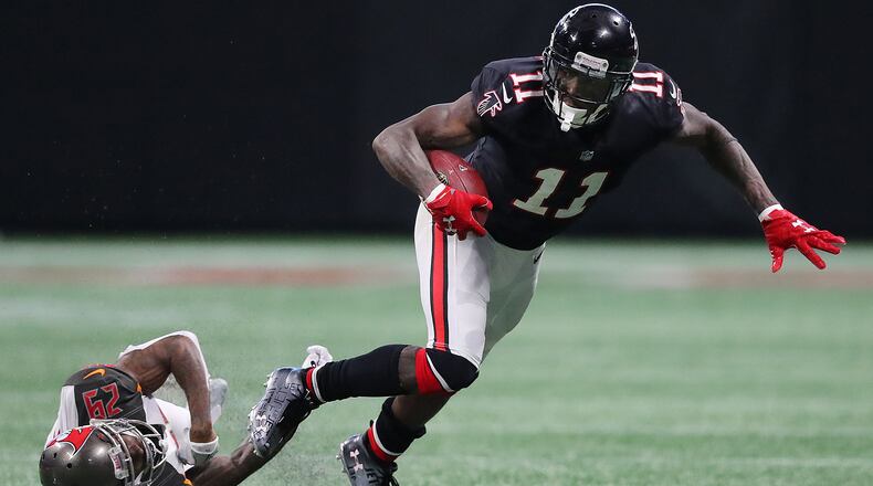 November 26, 2017 Atlanta: Falcons wide receiver Julio Jones makes a first down catch against Buccaneers defender Ryan Smith during the second half in a NFL football game on Sunday, November 26, 2017, in Atlanta.   Curtis Compton/ccompton@ajc.com