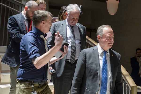 Sen. Tim Kaine, D-Va., center, and Sen. Adam Schiff, D-Calif., right, arrive for a classified briefing on President Donald Trump's directed strikes on Iranian nuclear facilities last weekend, at the Capitol in Washington, Thursday, June 26, 2025. (AP Photo/Rod Lamkey, Jr.)