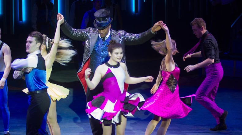 Ringmaster Tyron McFarlan (center) entertains the crowd in Alpharetta during a recent Sunday afternoon performance of the Big Apple Circus, which is in its 40th anniversary season. STEVE SCHAEFER / SPECIAL TO THE AJC
