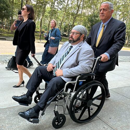 Former cargo ship captain John Merrone is wheeled out of federal court in the Brooklyn borough of New York by his lawyer, Bruce Barket, Wednesday, July 15, 2026, after pleading guilty to charges he drugged and sexually assaulted a U.S. Merchant Marine Academy cadet in 2019 while she was working on the vessel. (AP Photo/Michael R. Sisak)