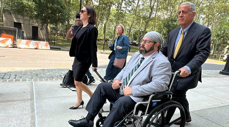Former cargo ship captain John Merrone is wheeled out of federal court in the Brooklyn borough of New York by his lawyer, Bruce Barket, Wednesday, July 15, 2026, after pleading guilty to charges he drugged and sexually assaulted a U.S. Merchant Marine Academy cadet in 2019 while she was working on the vessel. (AP Photo/Michael R. Sisak)