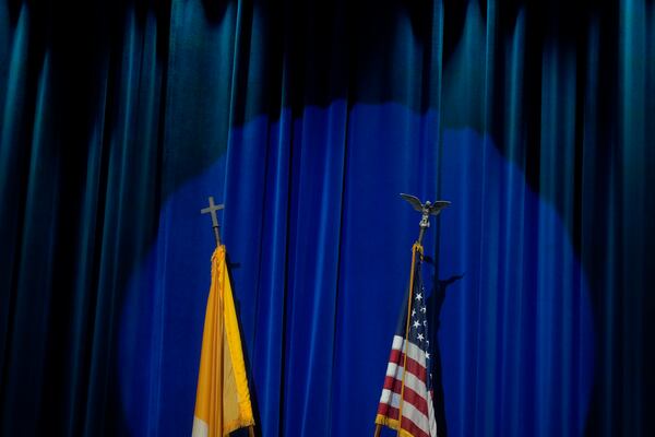 The U.S. and Vatican flags are displayed at the North American College in Rome, Friday, May 9, 2025, for a press conference with U.S. cardinals—one day after U.S. Cardinal Robert Francis Prevost was elected Pope Leo XIV. (AP Photo/Gregorio Borgia)