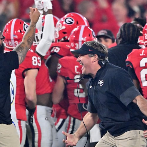 Georgia head coach Kirby Smart reacts as running back Cash Jones (background) celebrates with teammates recovering an onside kick during the second half in an NCAA football game at Sanford Stadium, Saturday, November 15, 2025, in Athens. Georgia won 35-10 over Texas. (Hyosub Shin / AJC)