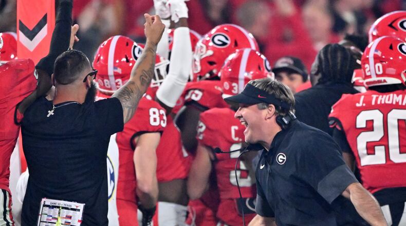 Georgia head coach Kirby Smart reacts as running back Cash Jones (background) celebrates with teammates recovering an onside kick during the second half in an NCAA football game at Sanford Stadium, Saturday, November 15, 2025, in Athens. Georgia won 35-10 over Texas. (Hyosub Shin / AJC)