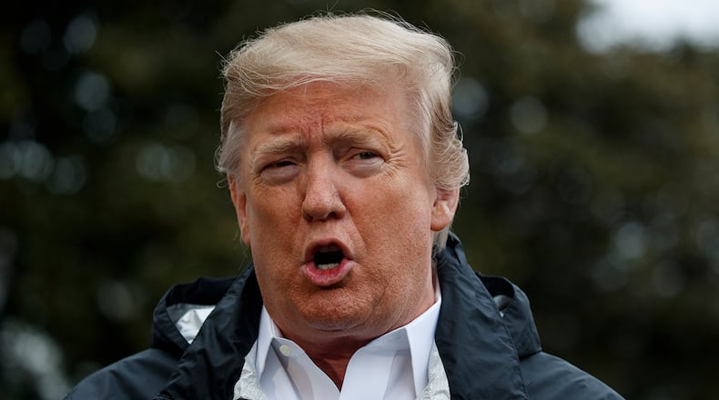 President Donald Trump talks with reporters outside the White House before traveling to Alabama to visit areas affected by the deadly tornadoes, Friday, March 8, 2019, in Washington. (AP Photo/ Evan Vucci)
