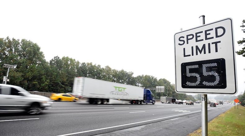 Atlanta drivers on the top end of I-285 will now have their speeds regulated by variable speed limits (VSL) signs posted along the perimeter highway as seen near Roswell Road during rush hour on Monday, Oct. 13, 2014 in Atlanta. The new electronic signs went into effect in early October and they are capable of changing speed limits to either higher or lower speeds as traffic ebbs and flows throughout the day. David Tulis / AJC Special