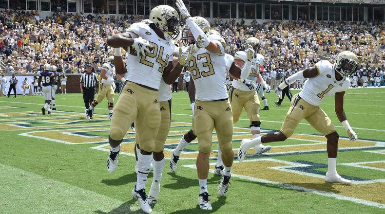 September 1, 2018 Atlanta - Georgia Tech running back Jordan Mason (24) celebrates with teammates after he scored a touchdown in the first half of the Georgia Tech home opener at Bobby Dodd Stadium on Saturday, September 1, 2018. HYOSUB SHIN / HSHIN@AJC.COM