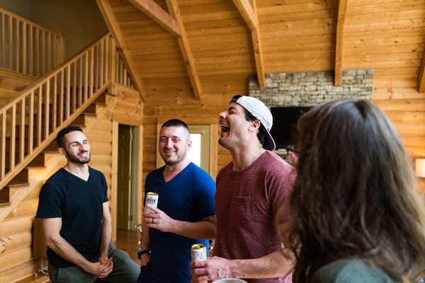 Friends attend a housewarming party for Baron Smith’s and Davis Adams’ lake house in March 2020.