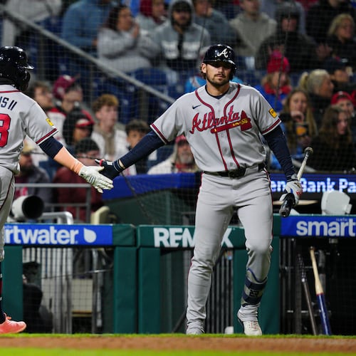 Atlanta Braves' Michael Harris II (23) celebrates with Austin Riley, right, after scoring during the fifth inning of a baseball game against the Philadelphia Phillies, Sunday, April 19, 2026, in Philadelphia. (AP Photo/Derik Hamilton)