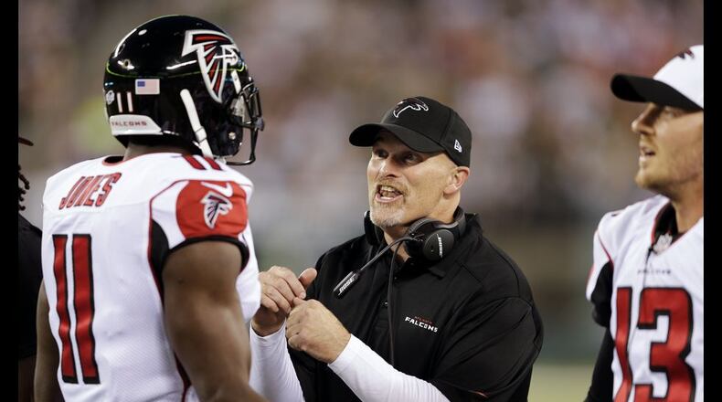 Falcons coach Dan Quinn encourages Julio Jones (11) during the first half Friday against the Jets. (AP Photo/Peter Morgan)