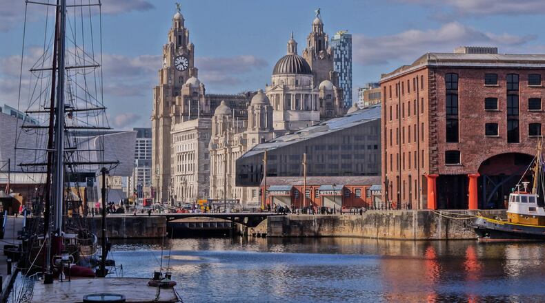 The domed Port of Liverpool Building, neighboring Royal Liver Building and Cunard Building make up the “Three Graces” at Albert Dock. CONTRIBUTED BY BEVERLEY GOODWIN