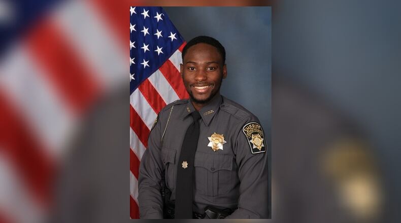 Fulton County sheriff's Deputy James Thomas, 24, was shot and killed Thursday. He was discovered in his wrecked Ford Fusion in the middle of Bolton Road in northwest Atlanta.