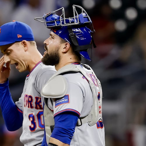 New York Mets pitcher Luke Weaver, left, reacts with catcher Luis Torrens, right, after their team defeated the Atlanta Braves during the 10th inning of a baseball game, Monday, July 6, 2026, in Atlanta. (AP Photo/Erik S. Lesser)