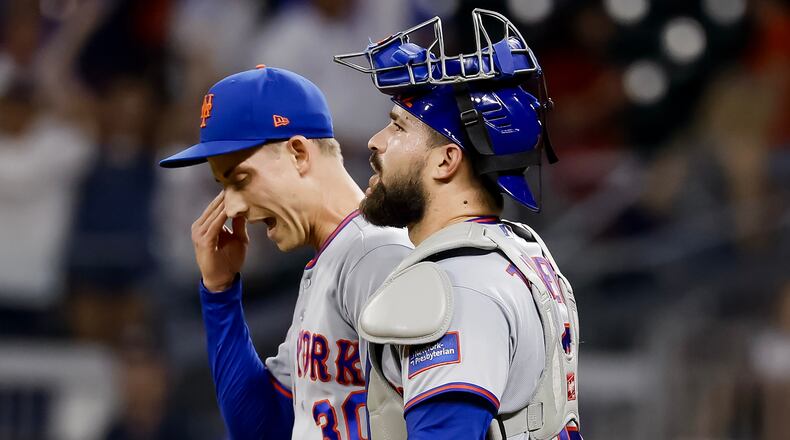 New York Mets pitcher Luke Weaver, left, reacts with catcher Luis Torrens, right, after their team defeated the Atlanta Braves during the 10th inning of a baseball game, Monday, July 6, 2026, in Atlanta. (AP Photo/Erik S. Lesser)