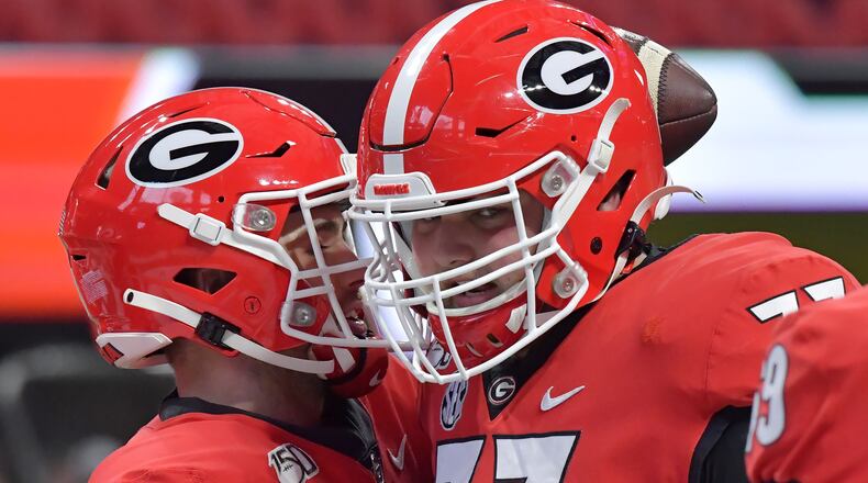 Georgia Bulldogs quarterback Jake Fromm (11) and offensive tackle Cade Mays (77)  prepare for the Georgia vs. LSU SEC Football Championship game at Mercedes-Benz Stadium in Atlanta.  Hyosub Shin / hyosub.shin@ajc.com