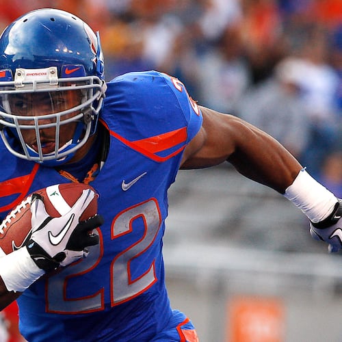 FILE - Boise State's doug Martin runs for a first down during the first half of the NCAA college football game against Toledo, Saturday, Oct. 9, 2010 in Boise, Idaho. (AP Photo/Matt Cilley, File)