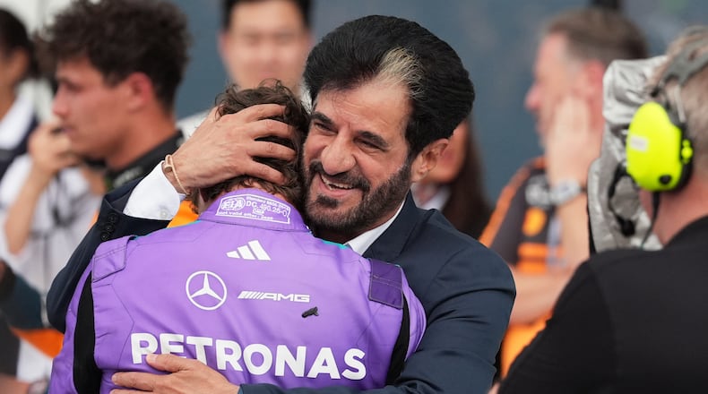 Mohammed Ben Sulayem President of the Federation Internationale de l'Automobile (FIA) hugs Mercedes driver Kimi Antonelli of Italy after Antonelli won the Miami Formula One Grand Prix auto race, Sunday, May 3, 2026, in Miami Gardens, Fla. (AP Photo/Rebecca Blackwell)