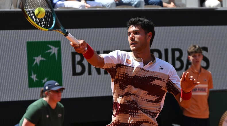 Adolfo Daniel Vallejo of Paraguay returns to Moise Kouame of France during their second round men's singles tennis match at the French Open tennis tournament in Paris, Thursday, May 28, 2026. (AP Photo/Emma Da Silva)
