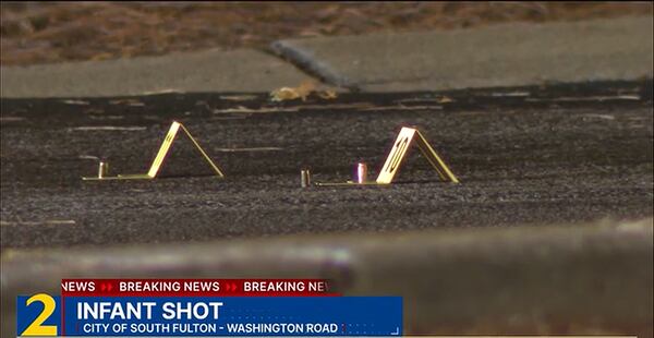 Evidence markers sit by shell casings at the scene of a shooting that left a boy injured in South Fulton. (Channel 2 Action News)