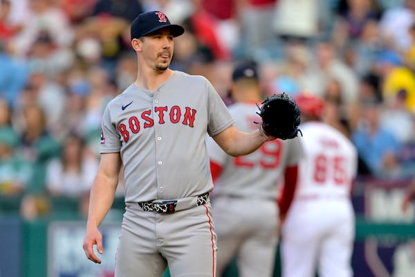 Boston Red Sox starting pitcher Walker Buehler reacts after giving up a solo home run to Los Angeles Angels' Zach Neto on the first pitch of a baseball game during the first inning, Monday, June 23, 2025, in Anaheim, Calif. (AP Photo/Jayne Kamin-Oncea)