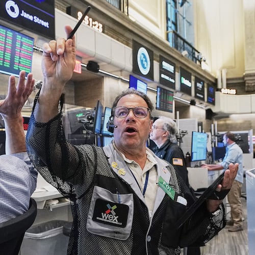 Options trader Anthony Spina, center, works on the floor of the New York Stock Exchange, Tuesday, June 16, 2026. (AP Photo/Richard Drew)