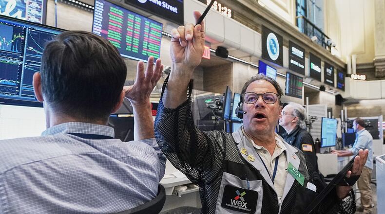 Options trader Anthony Spina, center, works on the floor of the New York Stock Exchange, Tuesday, June 16, 2026. (AP Photo/Richard Drew)
