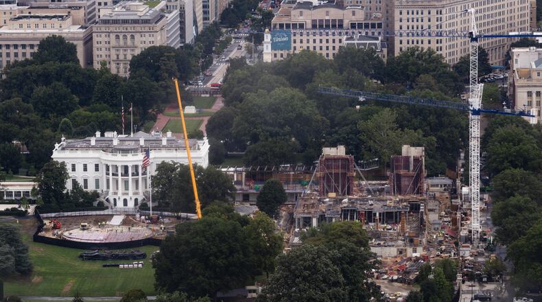 Construction continues on a helipad and the White House Ballroom on the South Lawn of the White House, Wednesday, Aug. 5, 2026, in Washington. (AP Photo/Tierney L. Cross)