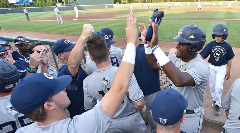 Georgia Tech outfielder Baron Radcliff (22) celebrates with teammates after he scored. HYOSUB SHIN / HSHIN@AJC.COM