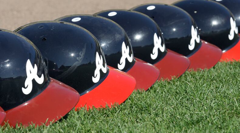 Atlanta Braves batting helmets during a spring training baseball workout Monday, Feb. 23, 2009 in Kissimmee, Fla. (AP Photo/David J. Phillip)