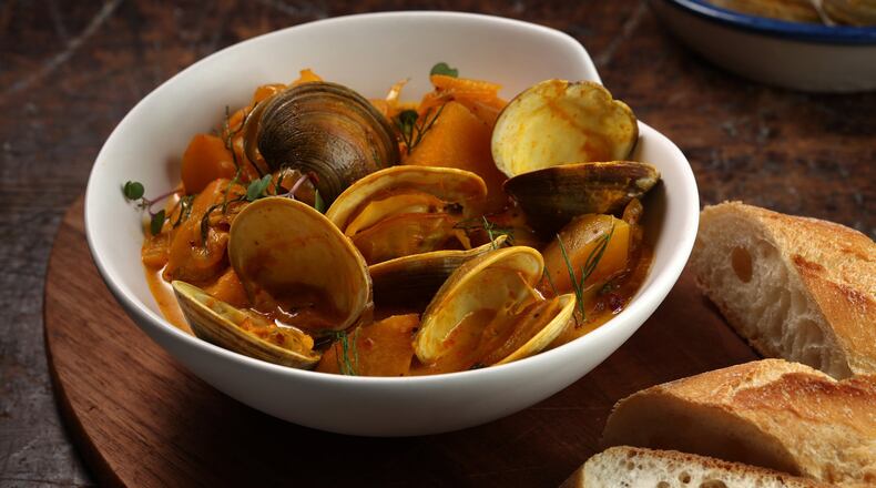 Saffron adds its beautiful fragrance to a bowl of steamed clams. (E. Jason Wambsgans/Chicago Tribune/TNS)