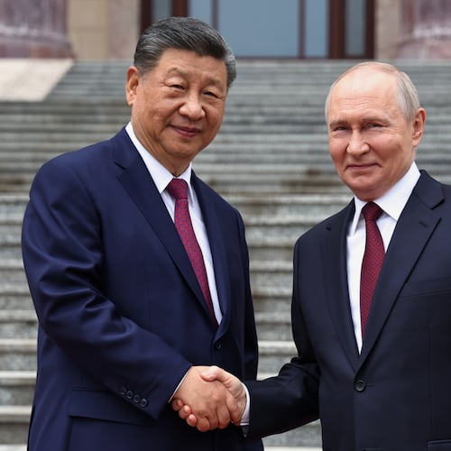 Russian President Vladimir Putin, right, and Chinese President Xi Jinping shake hands during a welcome ceremony at the Great Hall of the People, in Beijing, China, on Wednesday, May 20, 2026. (Alexander Kazakov, Sputnik, Kremlin Pool Photo via AP)