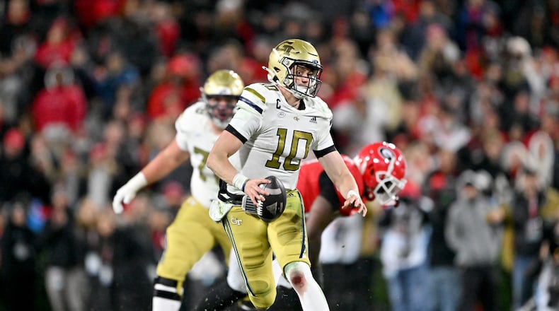 Georgia Tech quarterback Haynes King (10) runs the ball during the second half in an NCAA football game at Sanford Stadium, Friday, November 29, 2024, in Athens. Georgia won 44-42 in eight overtimes. (Hyosub Shin / AJC)