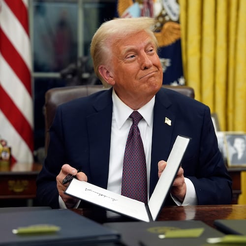 FILE - President Donald Trump signs executive orders in the Oval Office of the White House, Jan. 20, 2025, in Washington. (AP Photo/Evan Vucci, File)