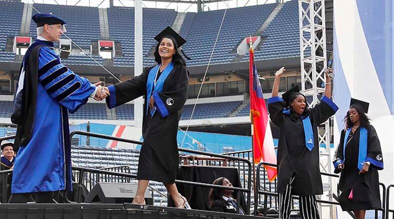 Atlanta - Georgia State University students get their diplomas at the commencement ceremony on May 9, 2019. Georgia State is the largest school in the University System of Georgia, with more than 50,000 students. Bob Andres / bandres@ajc.com