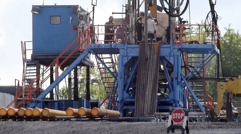 A crew works on a gas drilling rig at a well site for shale-based natural gas in Zelienople, Pa. (AP Photo/Keith Srakocic, File)