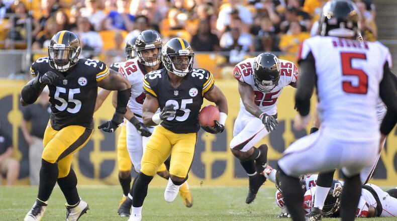 Pittsburgh Steelers Trey Williams (35) follows the block of Arthur Moats (55) after getting past Atlanta Falcons defenders Akeem King (25) and Duke Riley (42) to return the punt by punter Matt Bosher (5) for a touchdown in the third quarter of an NFL preseason football game, Sunday, Aug. 20, 2017, in Pittsburgh. (AP Photo/Fred Vuich)