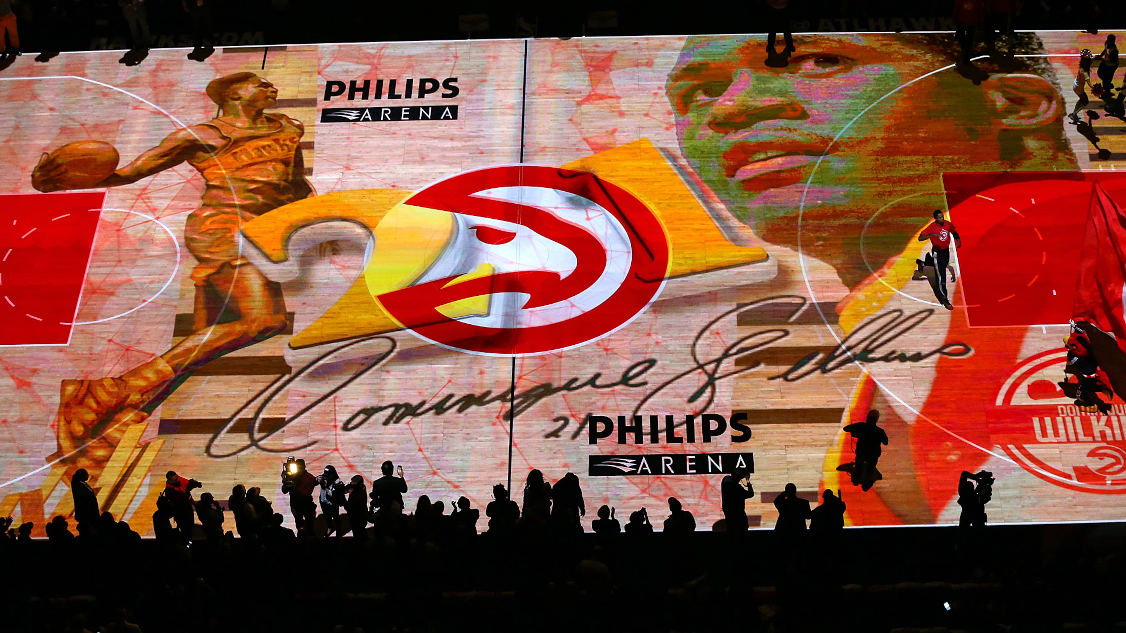 The hardwood is covered with a digital tribute to Hawks all-time leading scorer Dominique Wilkins on "Dominique Wilkins Night" to open a basketball game against the Cavaliers on Friday, March 6, 2015, in Atlanta. (Curtis Compton/AJC.com)