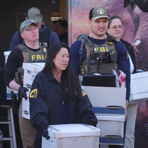 State and federal agents remove boxes of evidence collected from Metro Learning Center on Tuesday, April 28, 2026 in Minneapolis, Minn. (AP Photo/Mark Vancleave)