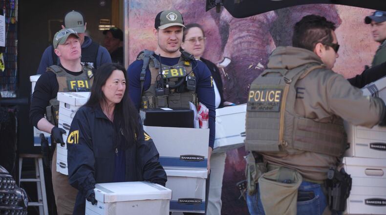 State and federal agents remove boxes of evidence collected from Metro Learning Center on Tuesday, April 28, 2026 in Minneapolis, Minn. (AP Photo/Mark Vancleave)