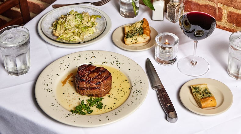 Hal's the Steakhouse takes inspiration from New Orleans, with plenty of seafood on the menu, That doesn't mean you can't get steak, caesar salad and a glass of red wine. It's a steakhouse, after all. (Bailey Garrot for the AJC)