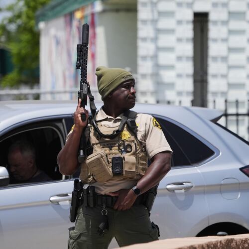A sheriff's deputy stages at the scene of a shooting outside the Islamic Center of San Diego Monday, May 18, 2026, in San Diego. (AP Photo/Gregory Bull)