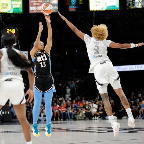 Atlanta Dream guard Allisha Gray shoots between Las Vegas Aces guard Jackie Young (left) and forward NaLyssa Smith during the first half of their Aug. 18 game in in Las Vegas. (Steve Marcus/Las Vegas Sun via AP)