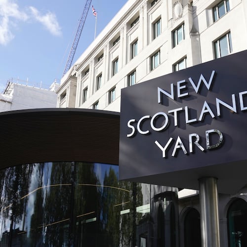 FILE - A sign stands in front of the New Scotland Yard, the headquarters of the London Metropolitan Police, in London, Sept. 25, 2023. (AP Photo/Kin Cheung, File)