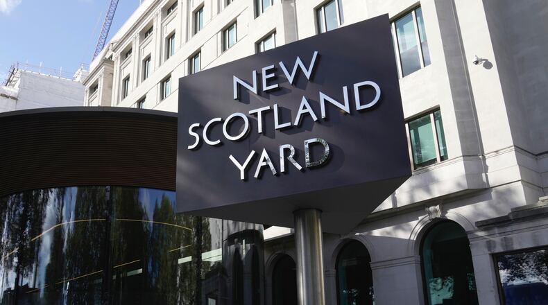 FILE - A sign stands in front of the New Scotland Yard, the headquarters of the London Metropolitan Police, in London, Sept. 25, 2023. (AP Photo/Kin Cheung, File)